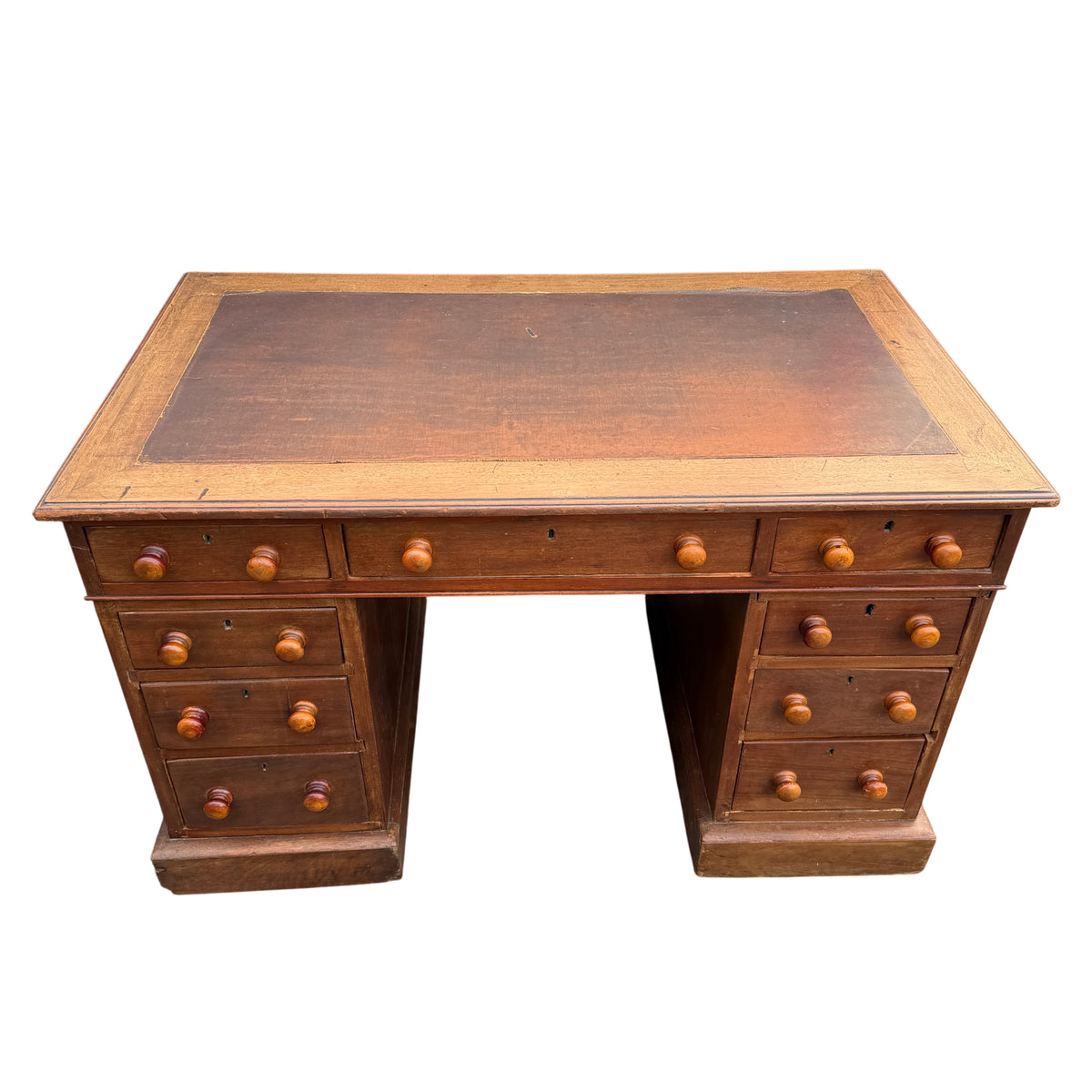 Close-up of inset leather writing top on a mahogany pedestal desk