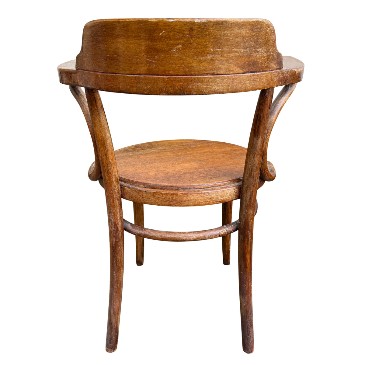 Close detail of finish wear and light scratches on a bentwood chair arm