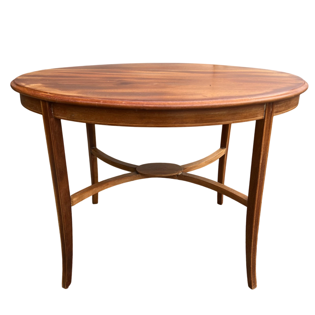 Vintage round wooden side table with slender legs and arched stretcher