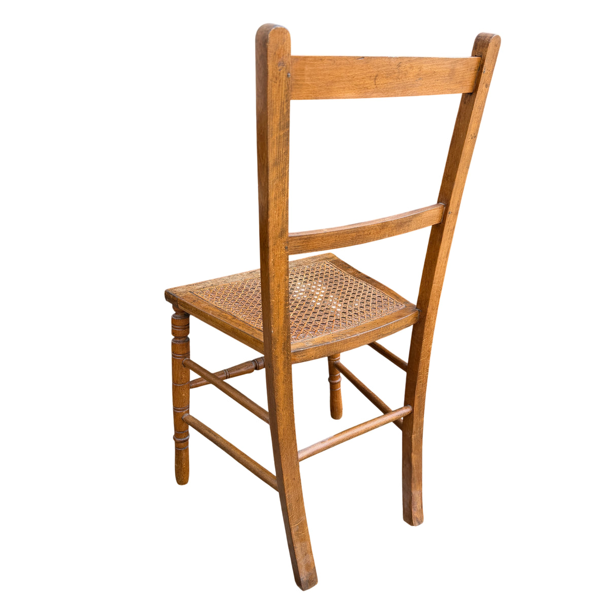 Vintage wooden dining chair set against outdoor background