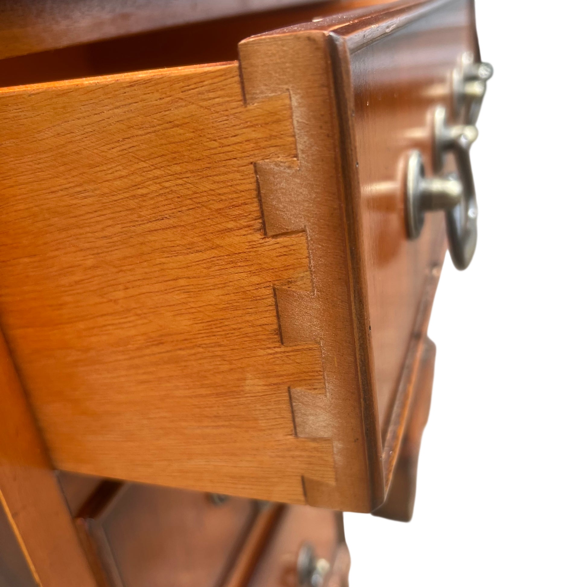 Lower pedestal and carved bracket feet on a vintage wooden desk