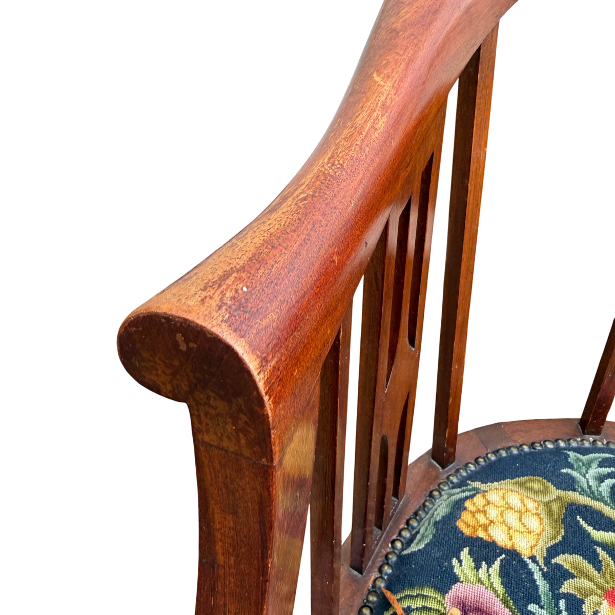 Detail of shaped leg and foot on early 20th-century style wooden armchair