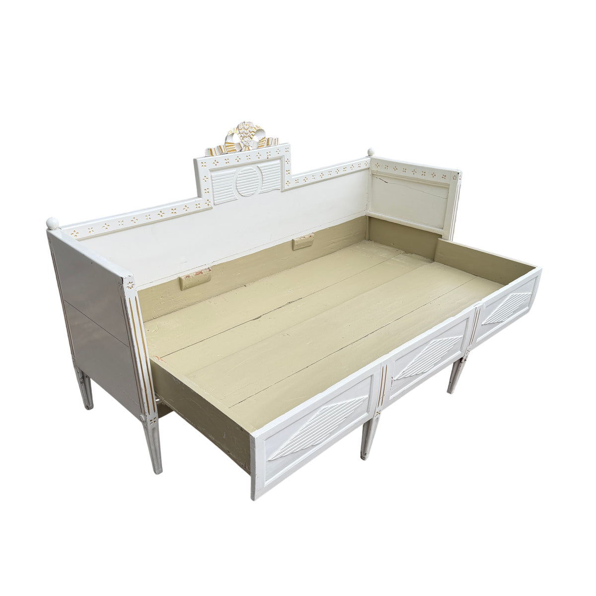Right-hand end of painted daybed showing ball finial and side crack