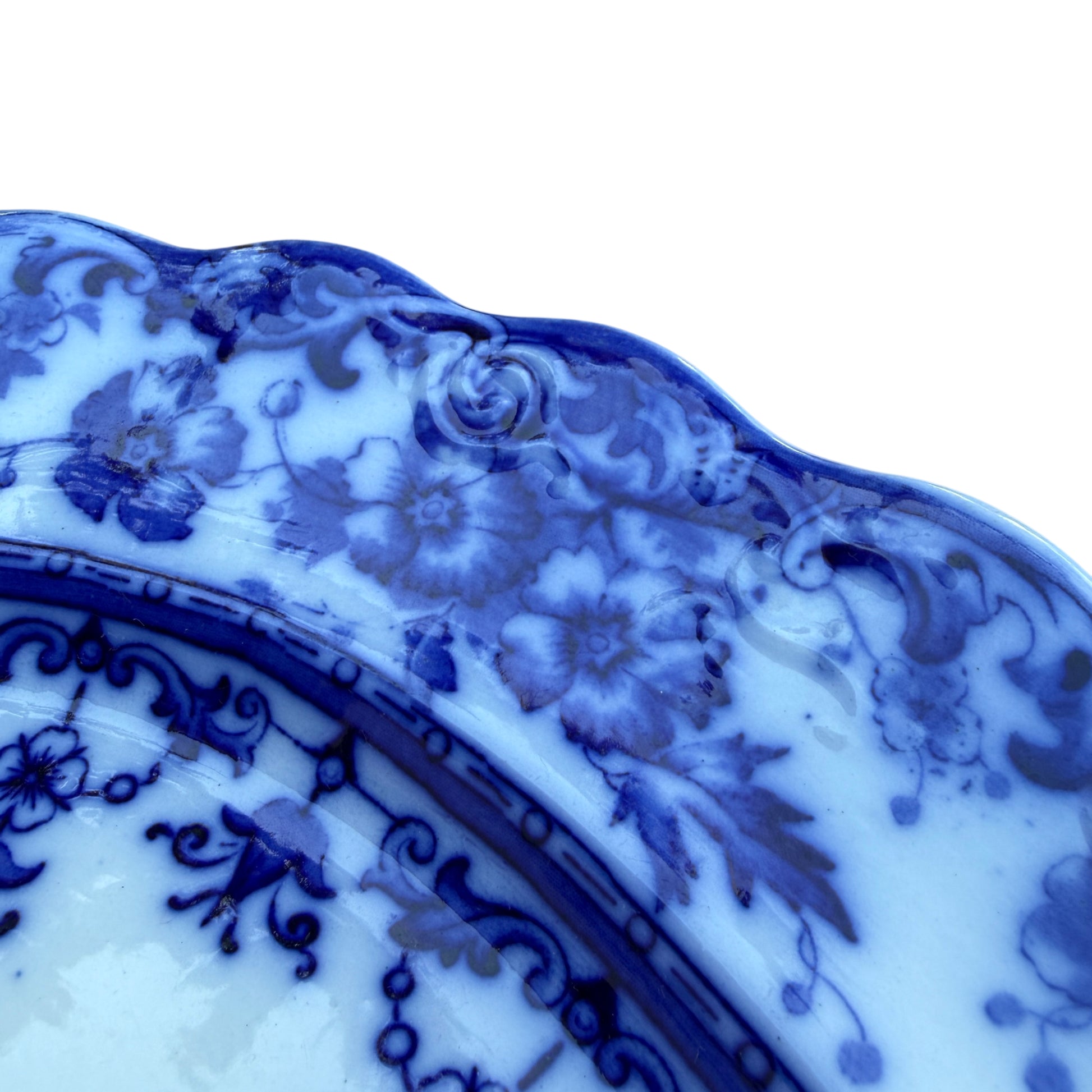 Close-up of underside showing glaze crazing and minor glaze flaking on base