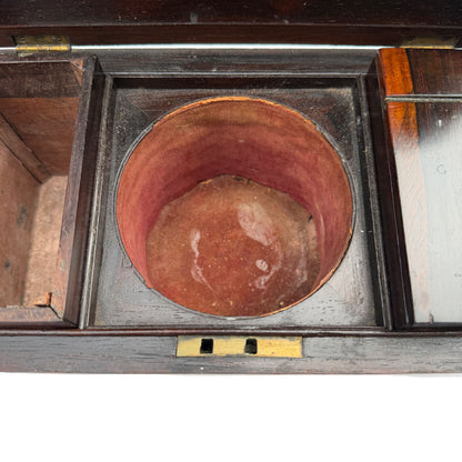 Close up of hinged lid underside and brass hinges of rosewood tea caddy