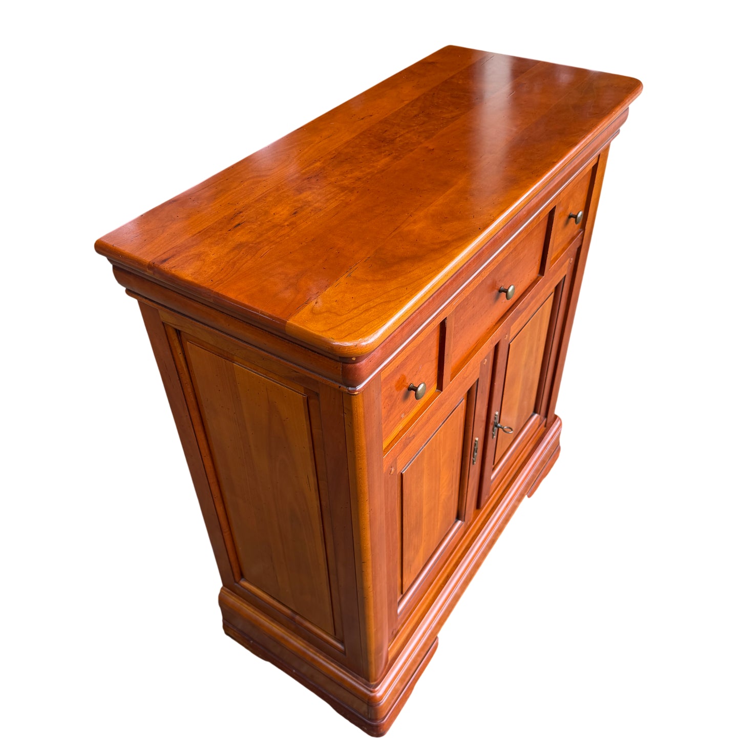 Full height view of compact wooden cupboard on moulded bracket feet