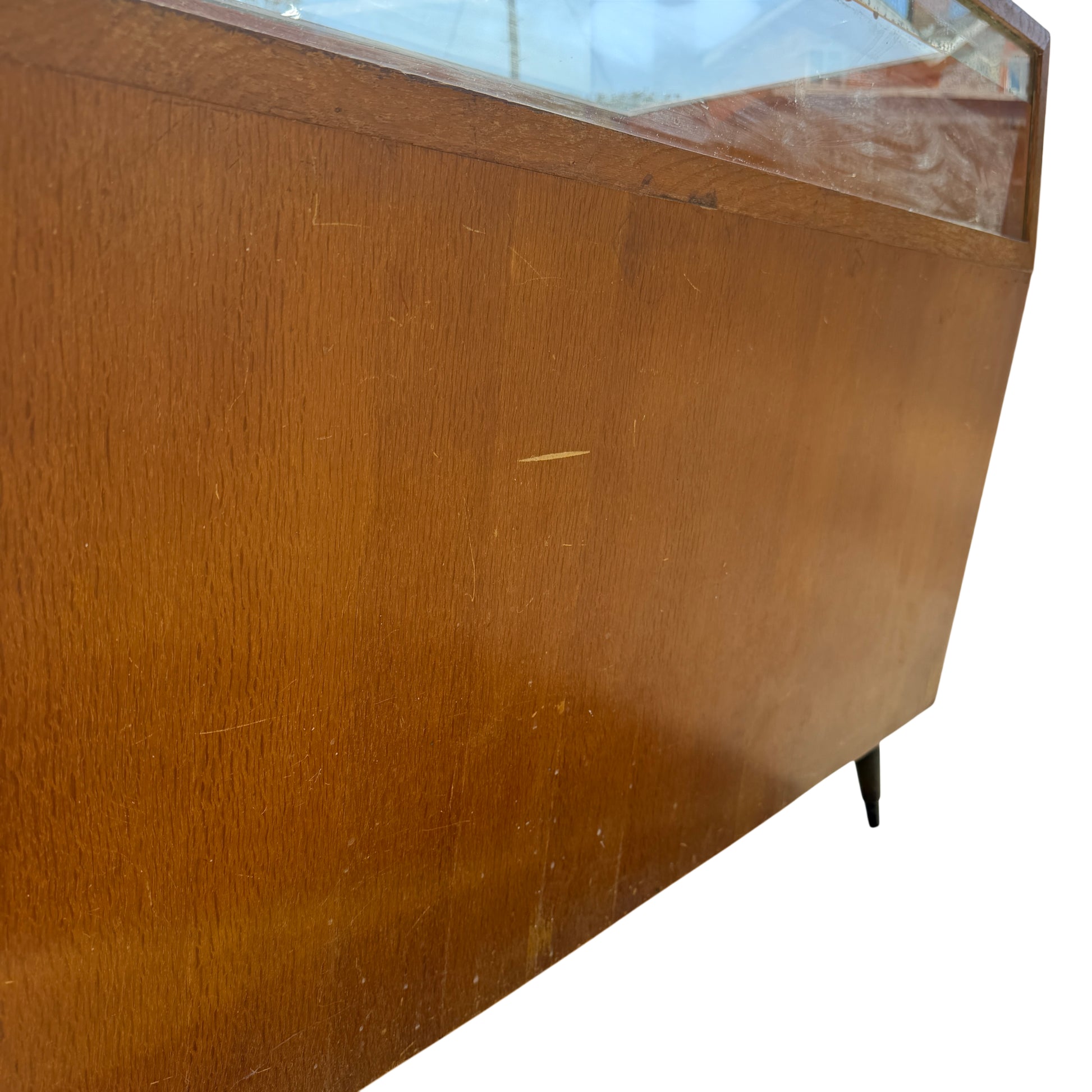 Front view of vintage shop counter with multiple drawers and curved metal handles