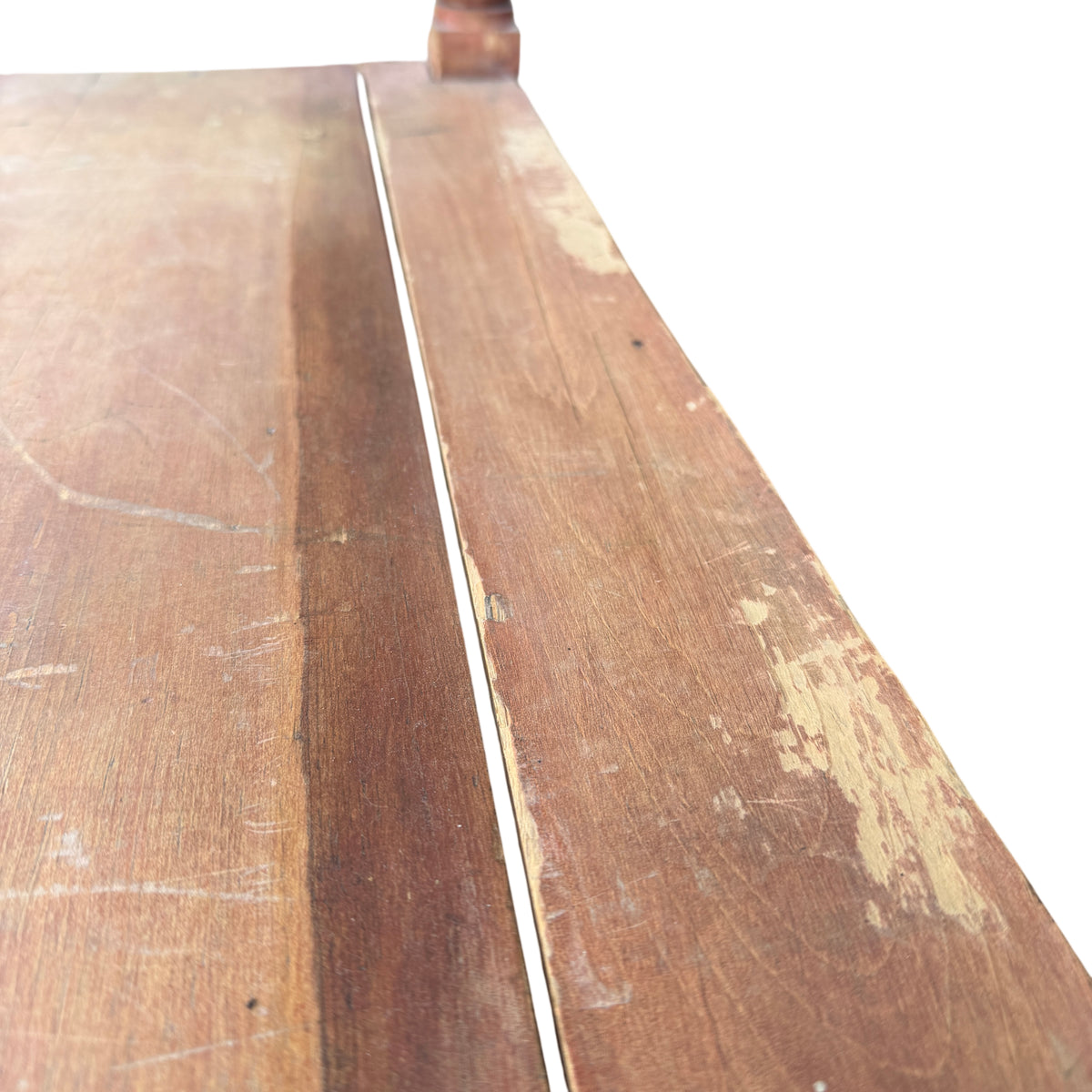 Edge detail of pine hall table top showing wear and small chips