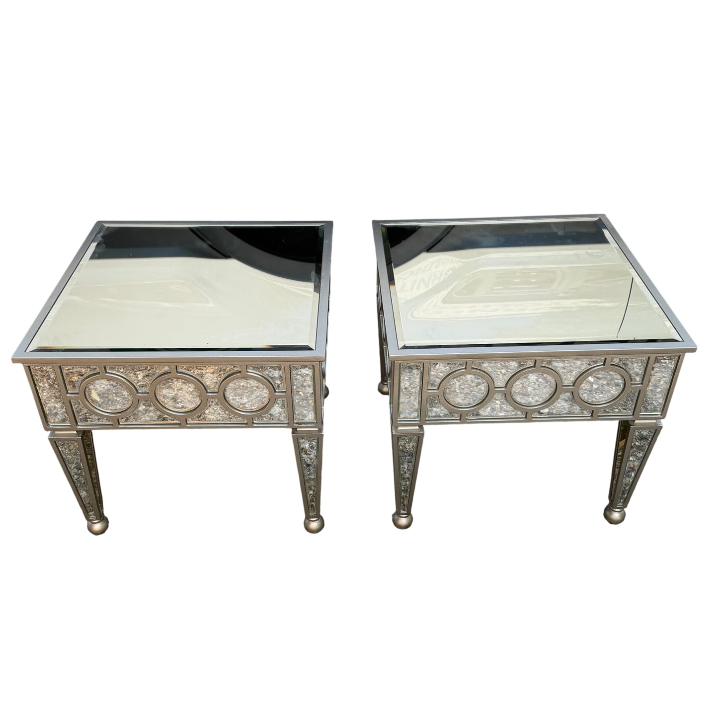 Pair of contemporary mirrored side tables with glass tops and silver finish