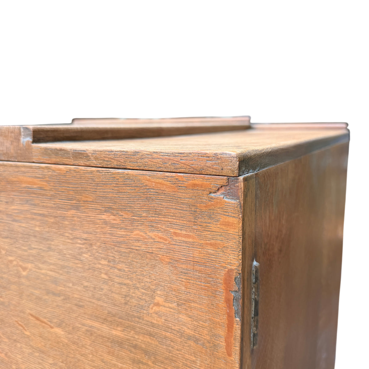 Detail of carved geometric panels on the central doors of oak cupboard