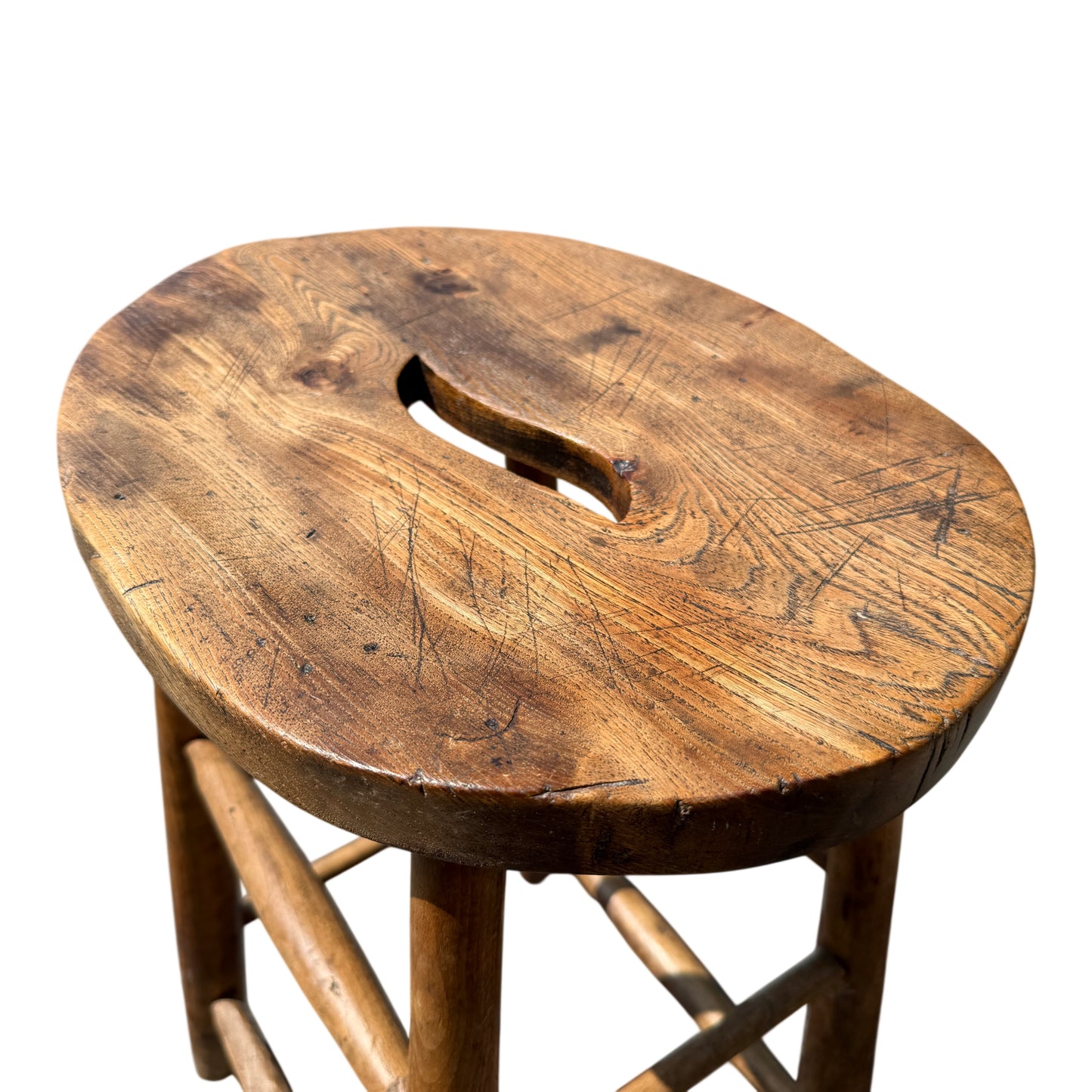Close-up of stool seat grain and knife marks in solid wood