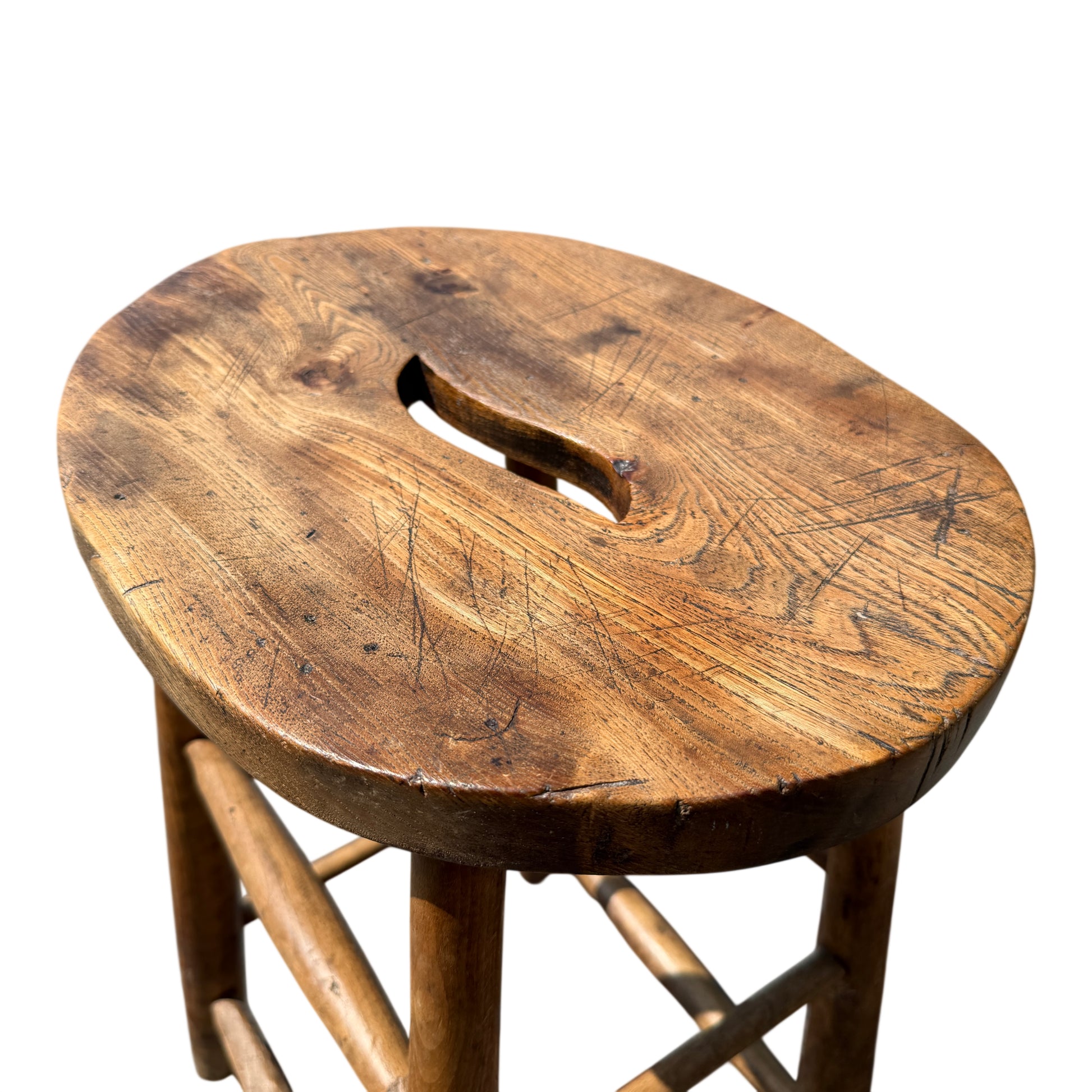 Close-up of stool seat grain and knife marks in solid wood