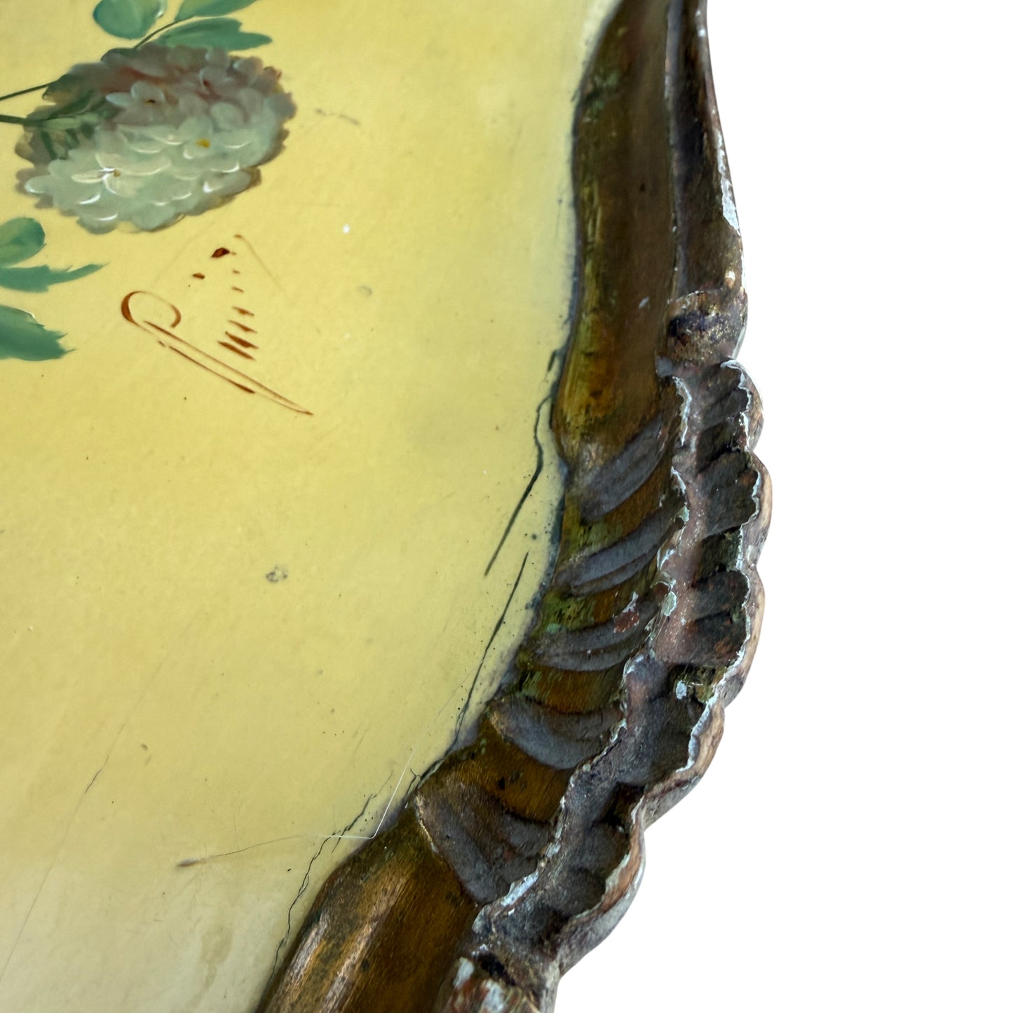 Gilt moulded frame and scalloped edge of vintage painted tray