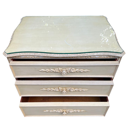 Top view of cream painted chest with fitted glass top and decorative edge moulding