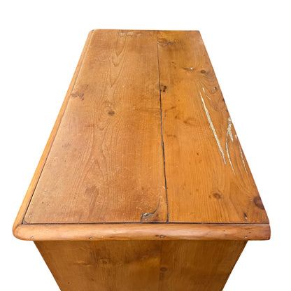 Two short top drawers above longer drawers on solid pine chest