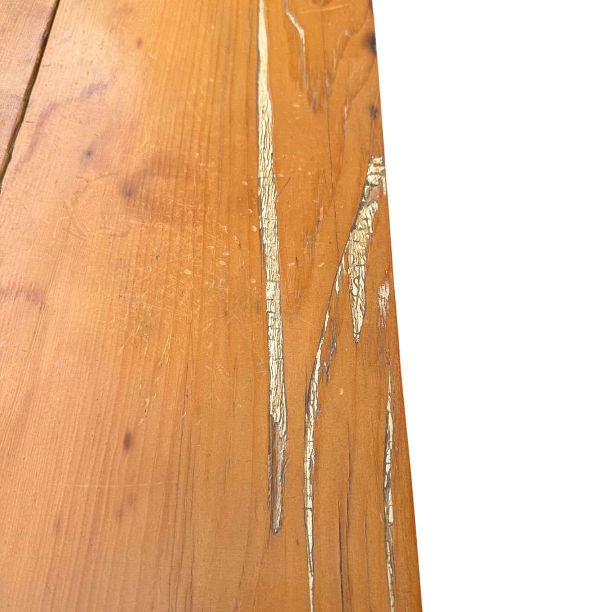 Side view showing turned bun leg and pine carcass of chest of drawers