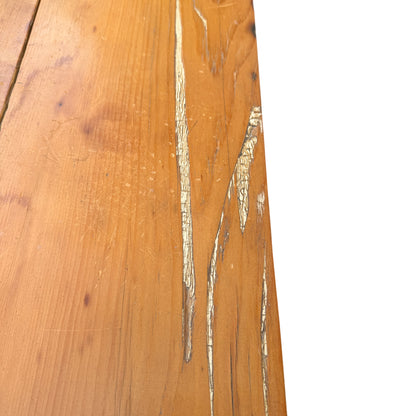 Side view showing turned bun leg and pine carcass of chest of drawers