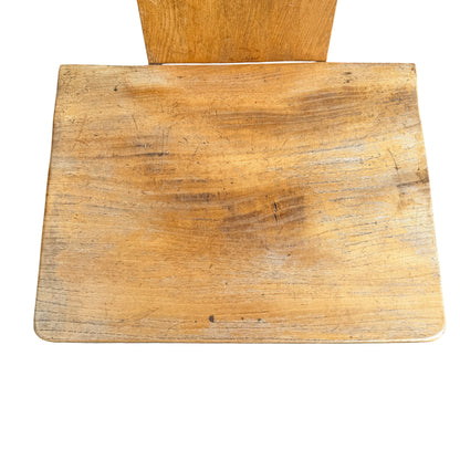 Side view of oak Arts & Crafts chair showing pegged joint and stretcher