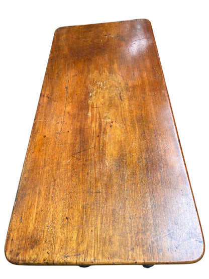 Corner detail of wooden console table with rounded top edge