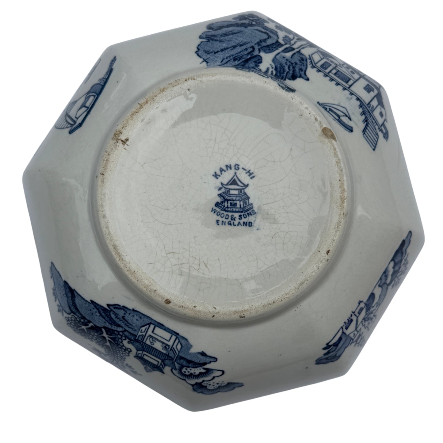 Angled view of octagonal porcelain serving bowl with blue and white transfer design