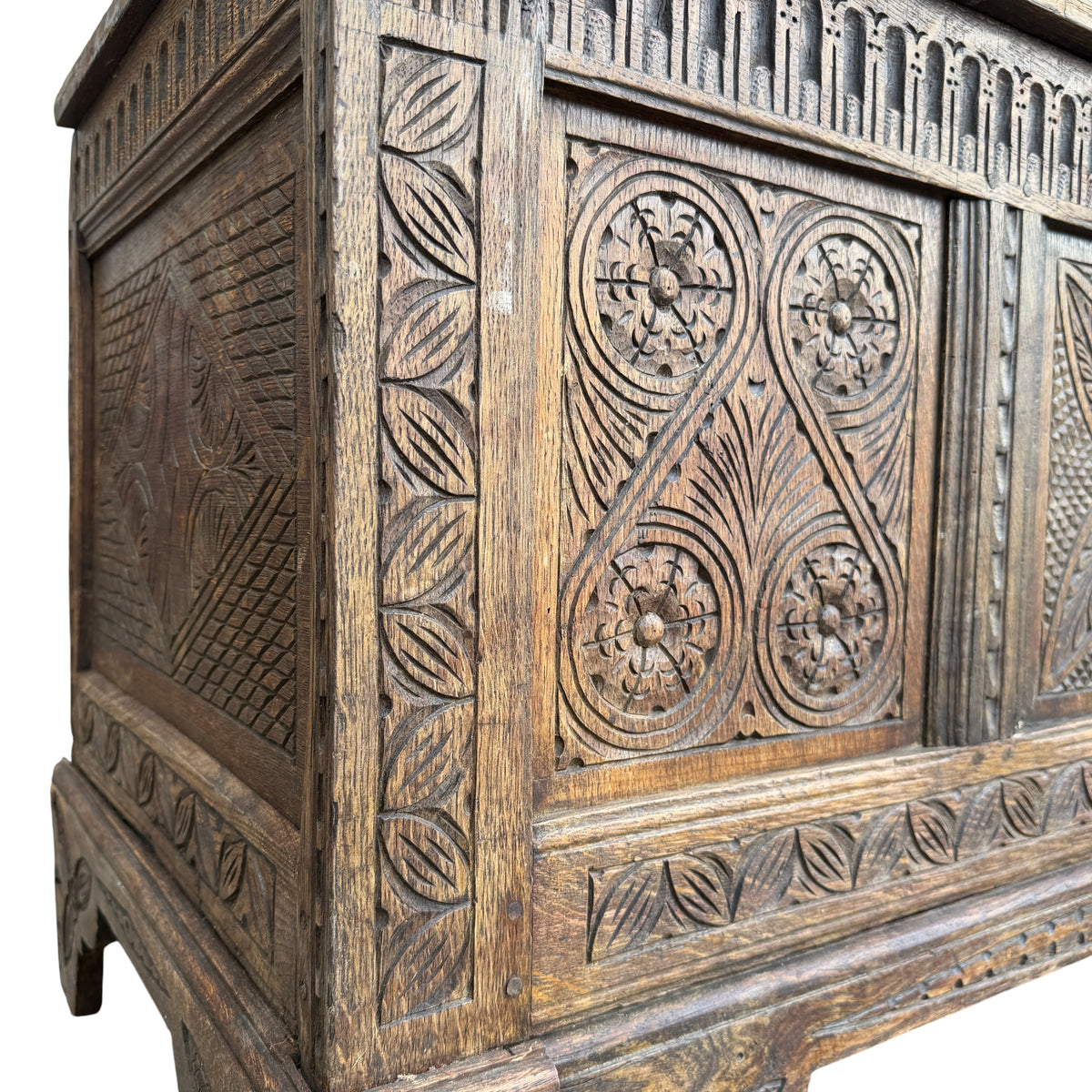Base and plinth of carved oak chest showing carved frieze and feet
