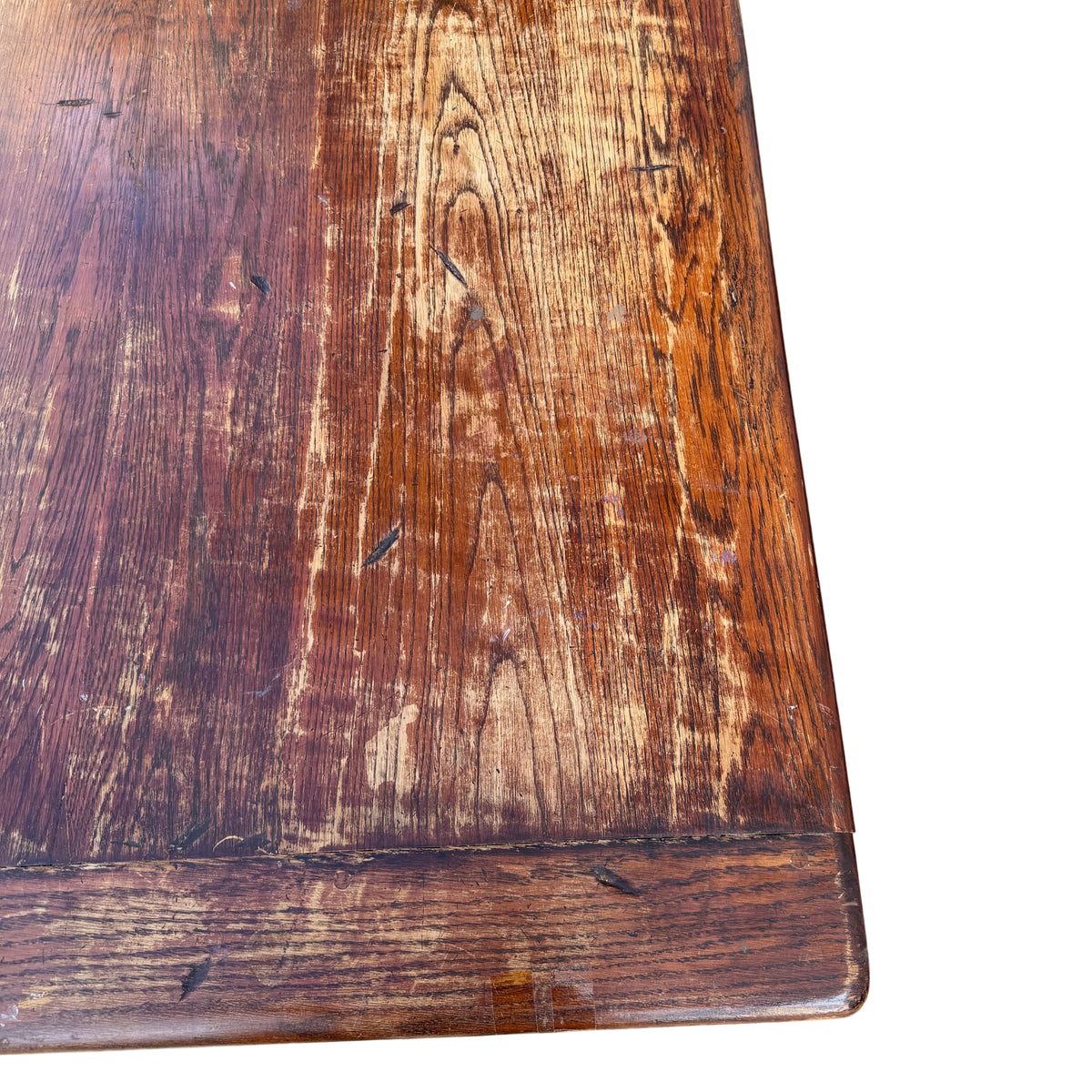Corner view showing overhanging edge and cleated reinforcement of oak table top