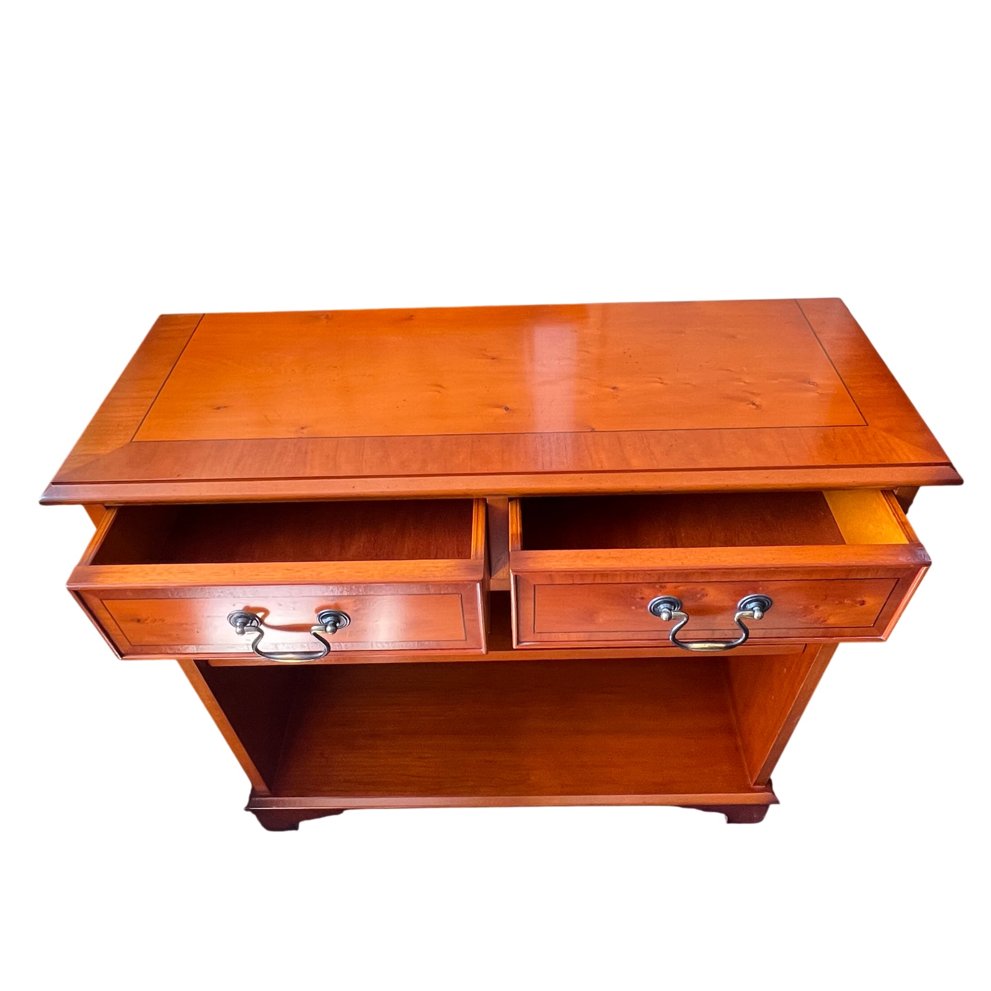 Two-drawer pine bookcase with open storage below in orange stain