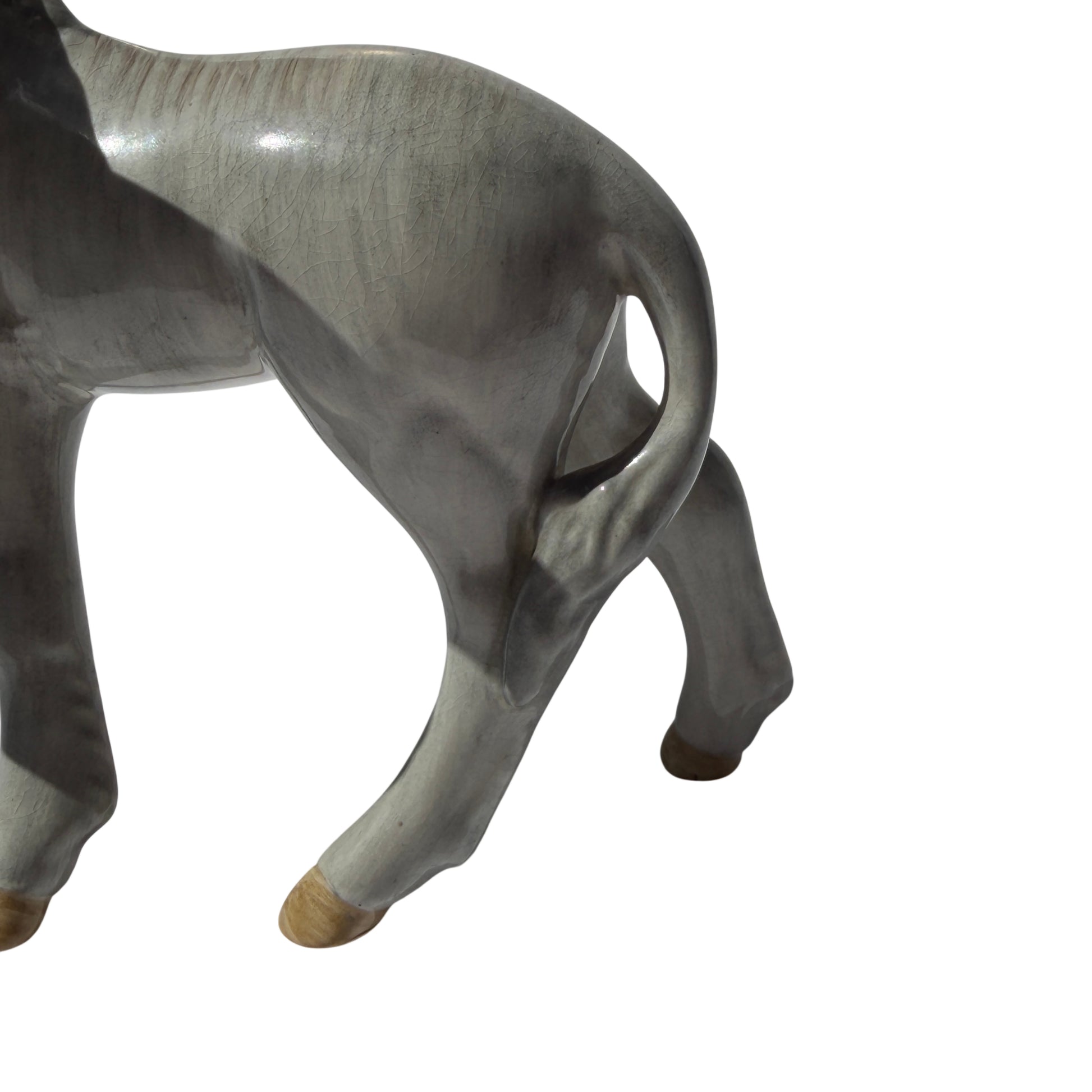 Top view of the donkey foal figurine showing glaze crazing and sculpted back