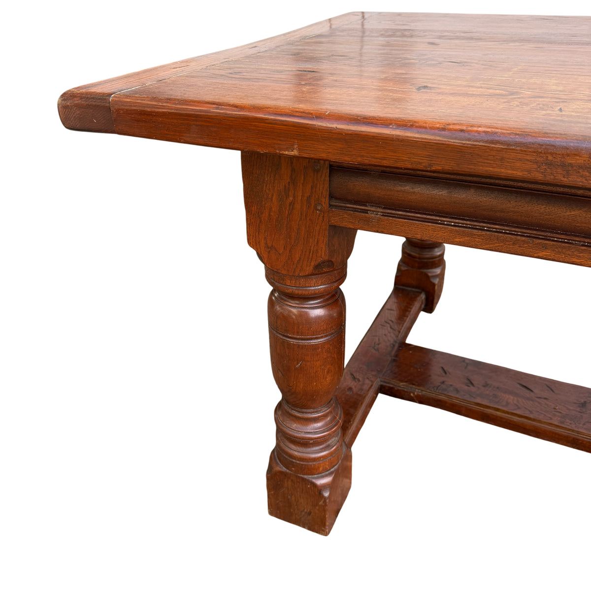 Close-up of solid oak plank tabletop with grain and cleated ends