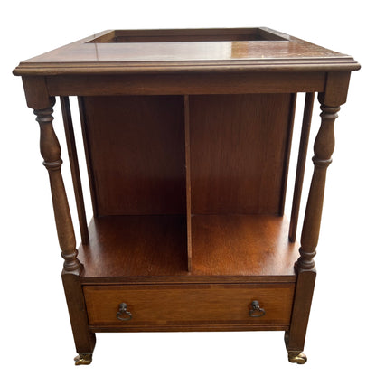 Wooden magazine storage cabinet with lower drawer and metal drop handles