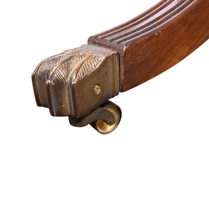 Close view of surface wear and ring marks on mahogany-veneer top