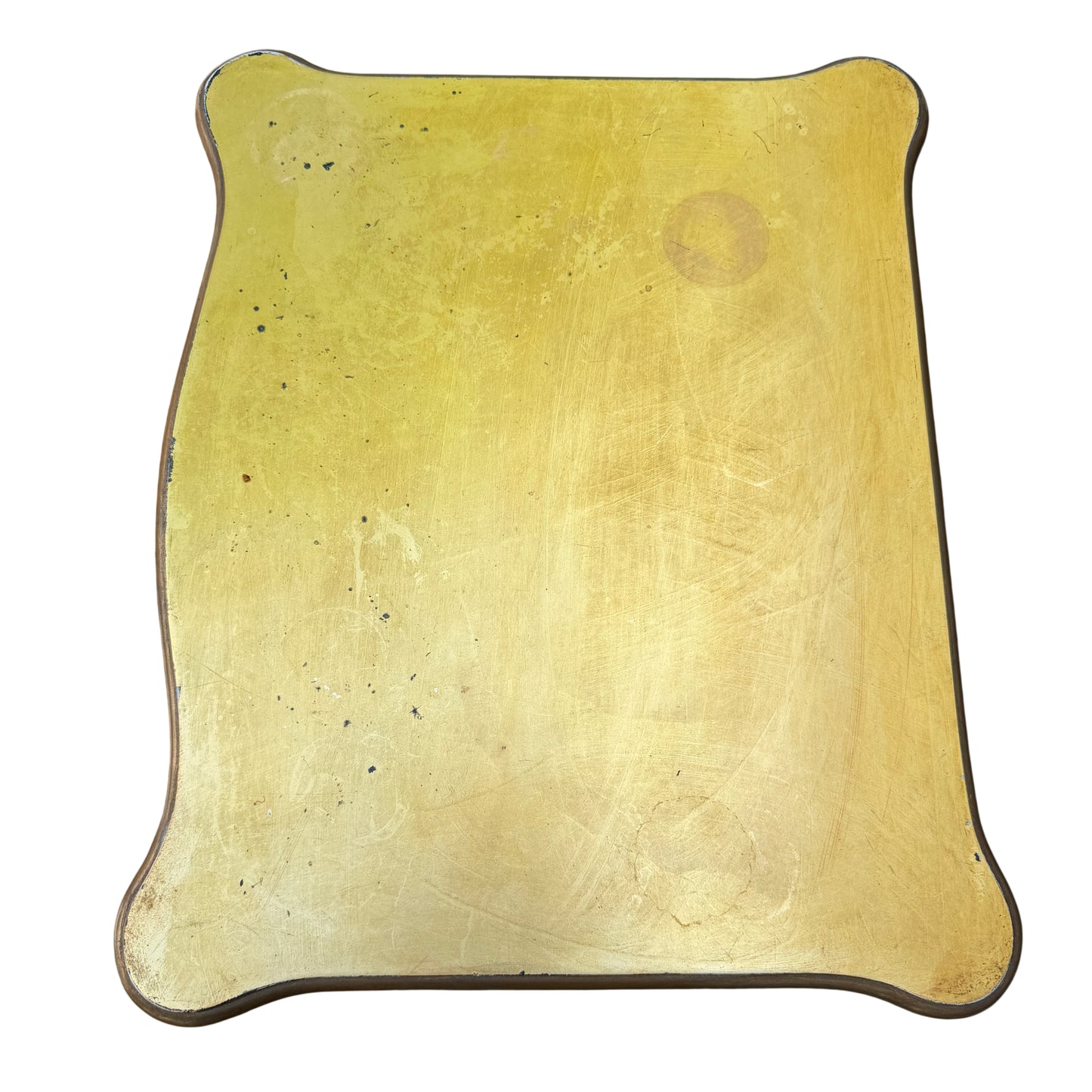 Caned lower shelf of bedside cabinet in painted gold finish