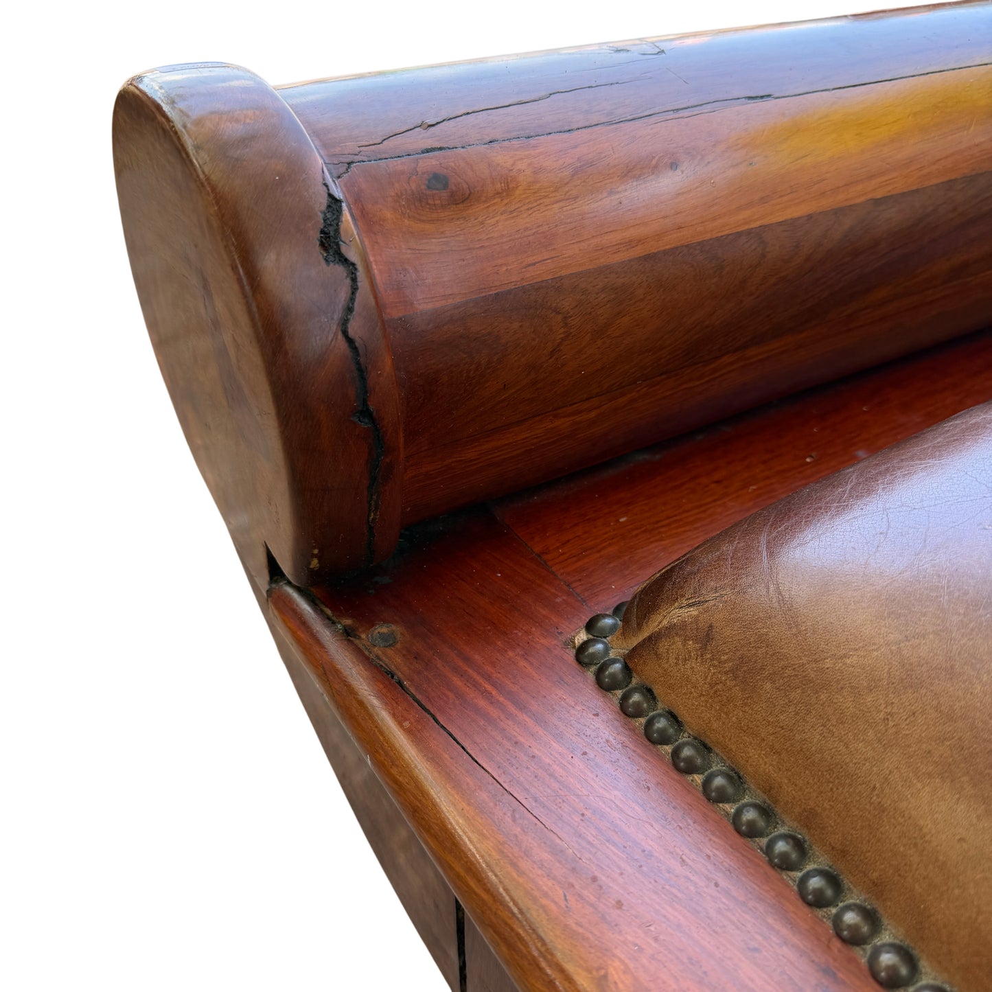 Wooden framed chaise longue showing aged finish and small cracks to timber