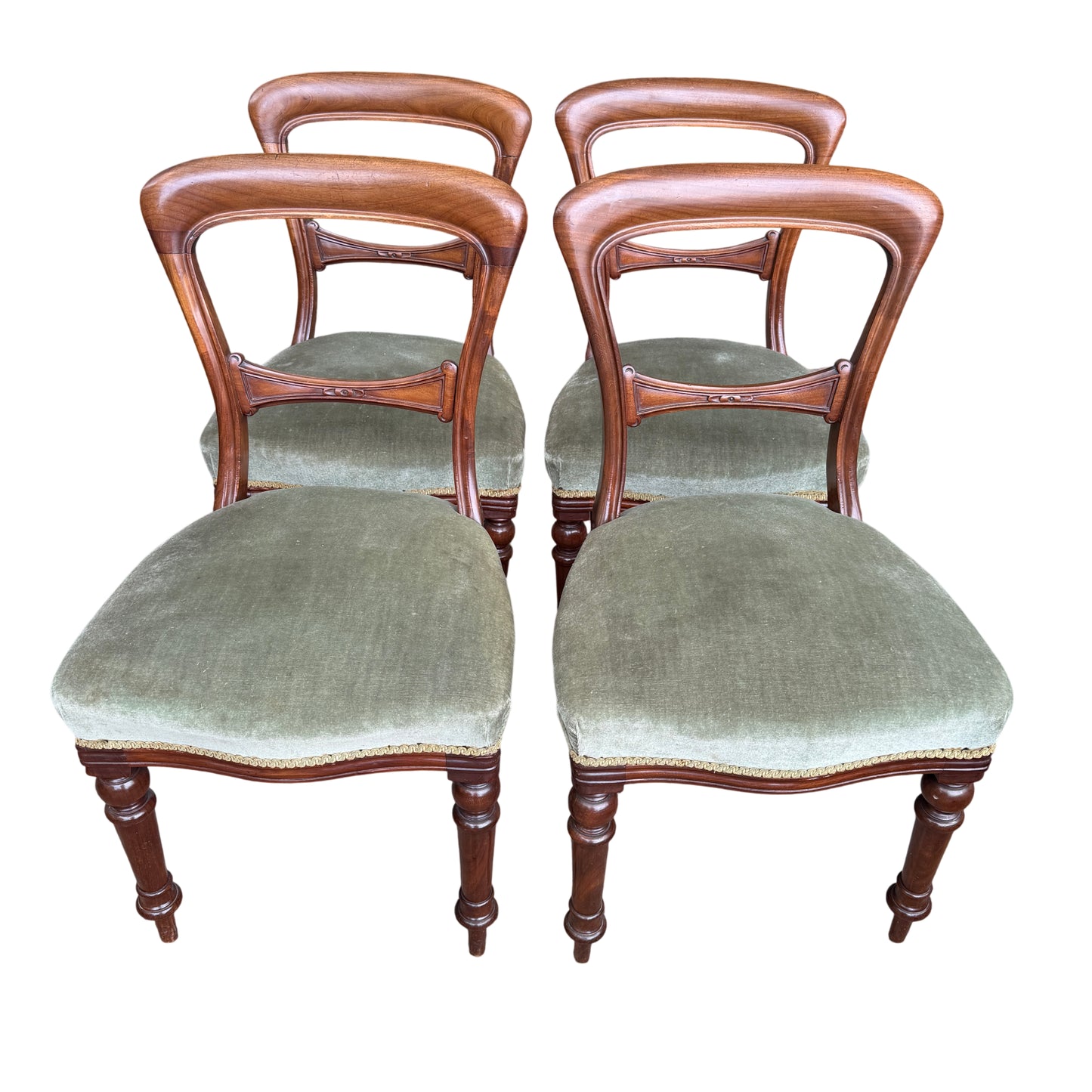 Close-up of green upholstered seat on a Victorian mahogany dining chair