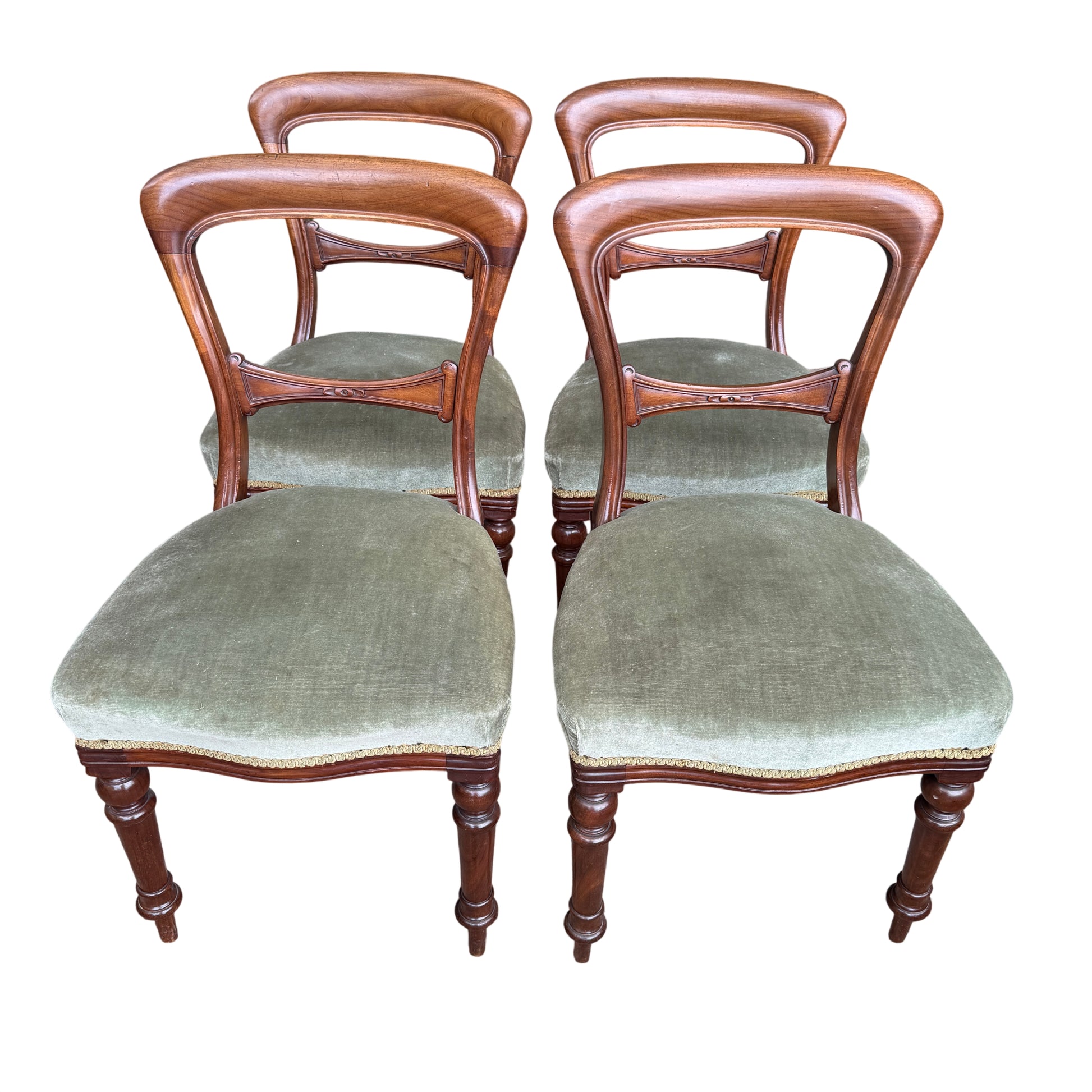 Close-up of green upholstered seat on a Victorian mahogany dining chair