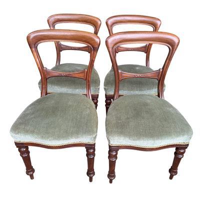 Close-up of green upholstered seat on a Victorian mahogany dining chair