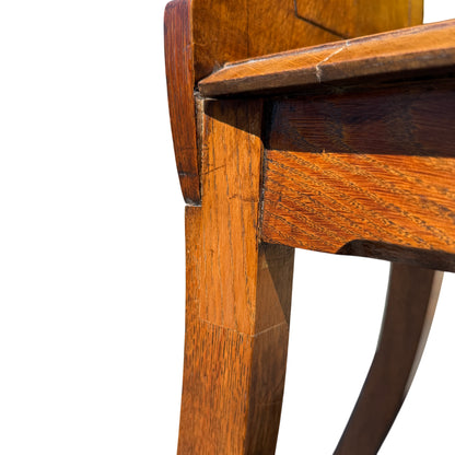 High angle shot of oak chair seat and top of turned legs