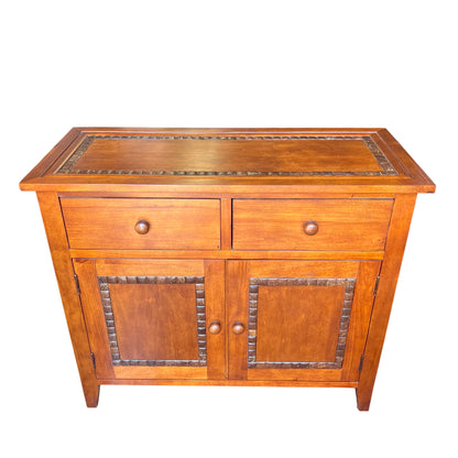 Arts & Crafts style oak two-door cabinet with two small drawers and turned wooden knobs