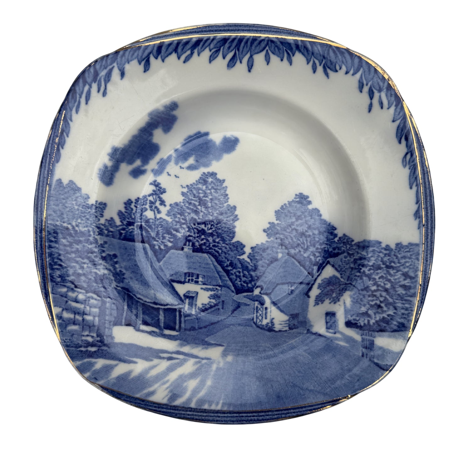 Curved square-shaped Burleigh Ware soup bowl with blue village scene and gilt rim