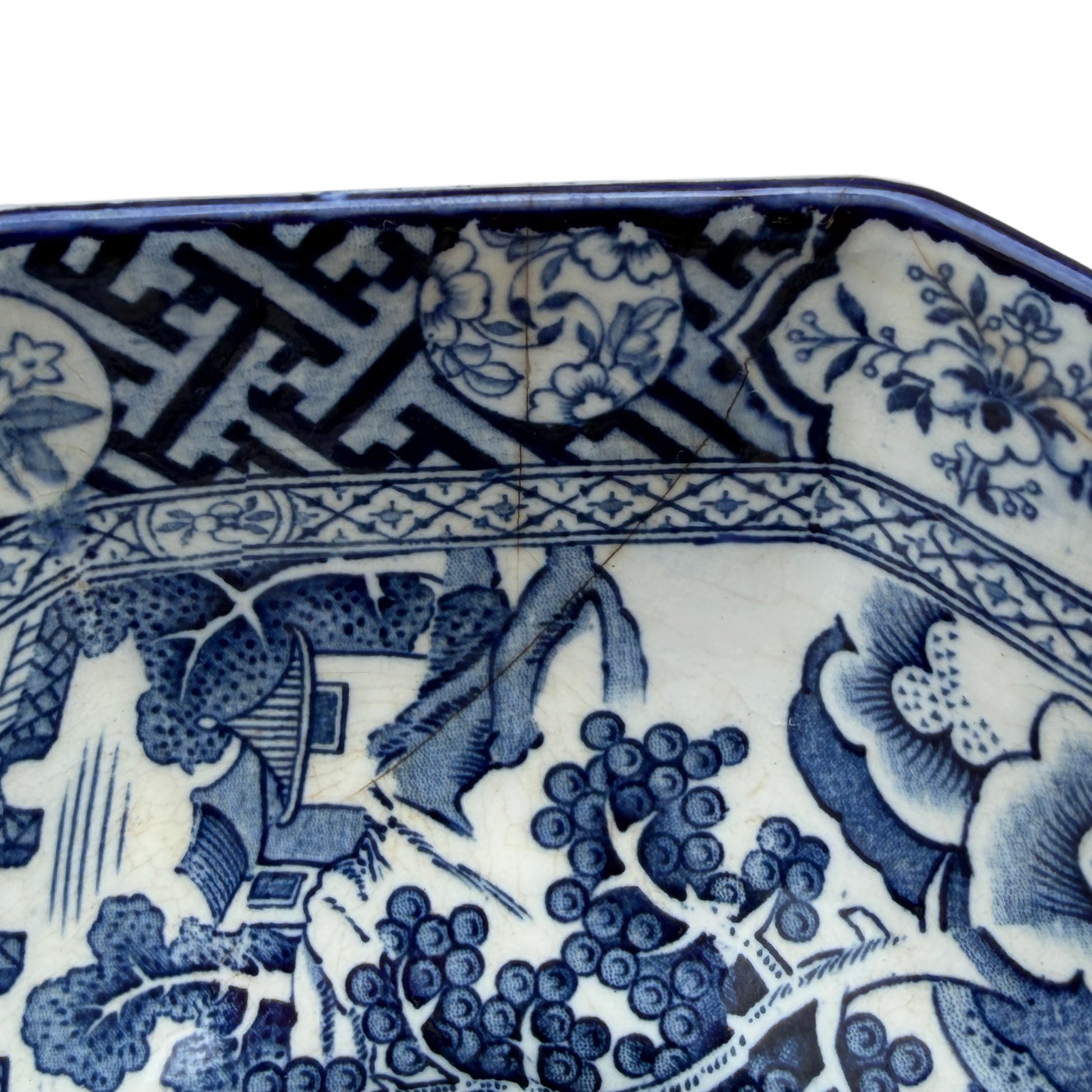 Interior composition showing pagoda, bridge and boat scene in blue transferware