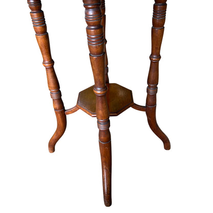 Octagonal top of walnut Victorian side table showing grain and finish