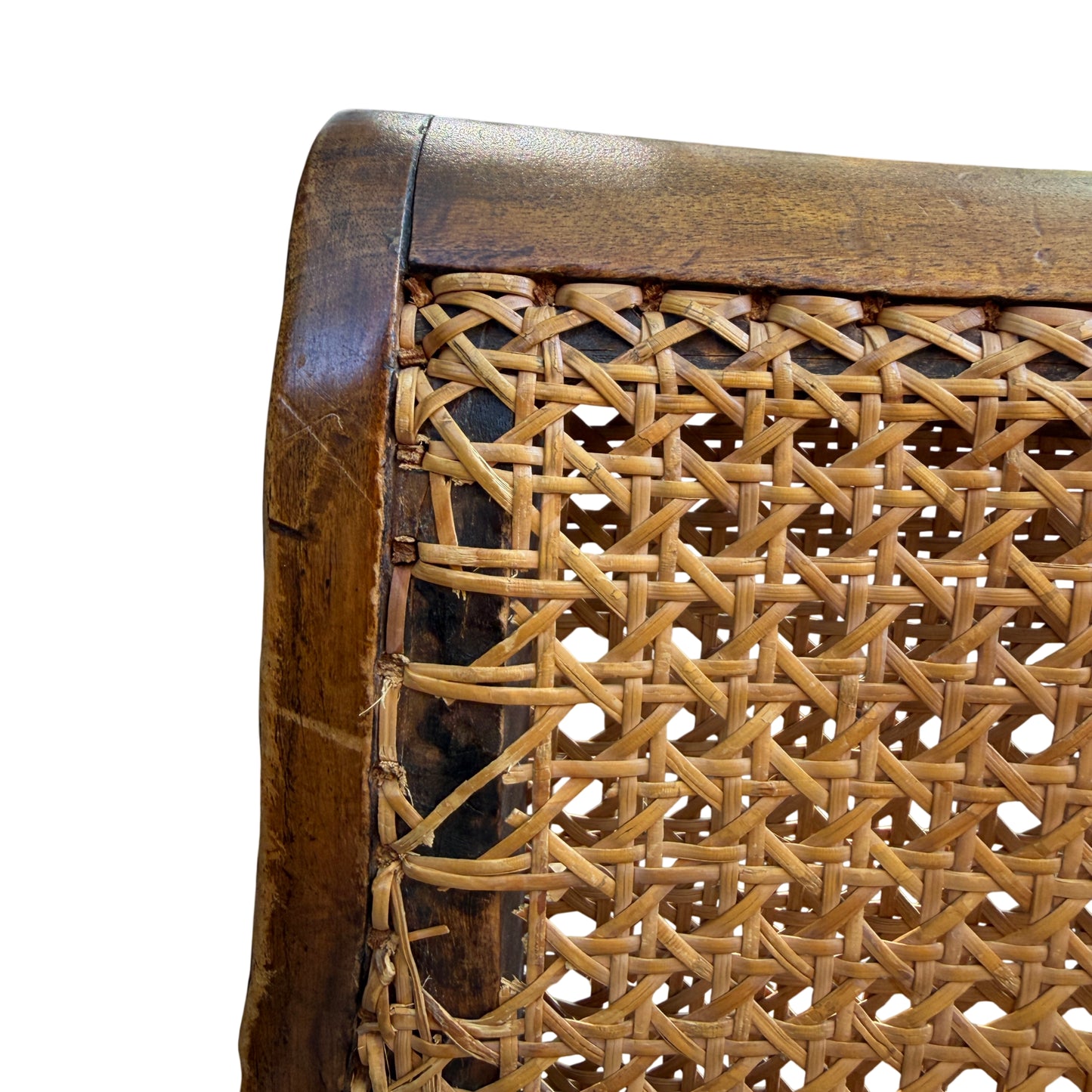 Detail of scrolling arm end and carved foliage motif on chair arm