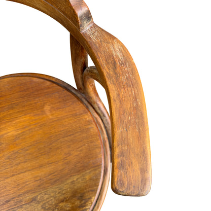 Close-up of arm/rail showing surface wear on a vintage bentwood chair