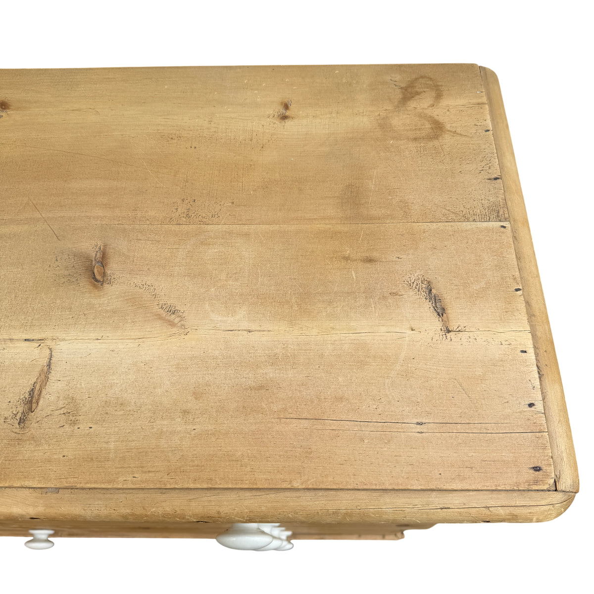 Pine chest of drawers with visible surface marks and aged patina