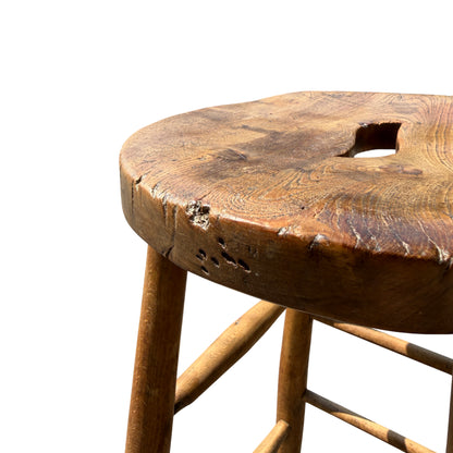Lower section of stool showing scuffs to legs and rounded foot ends