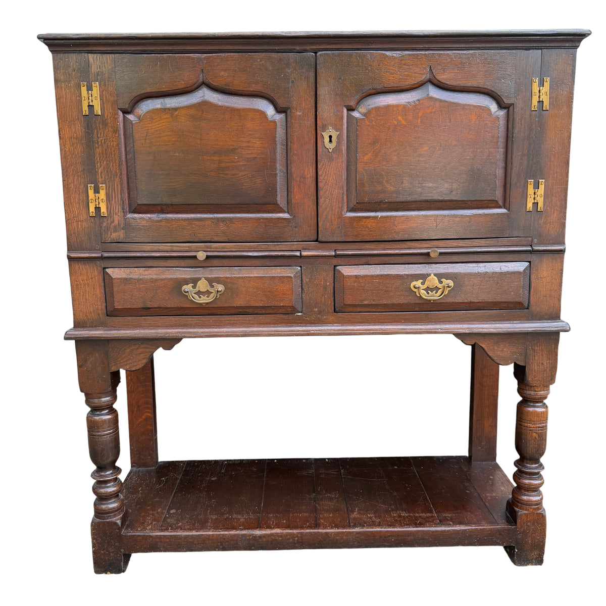 Compact oak cabinet on stand with two drawers and lower shelf