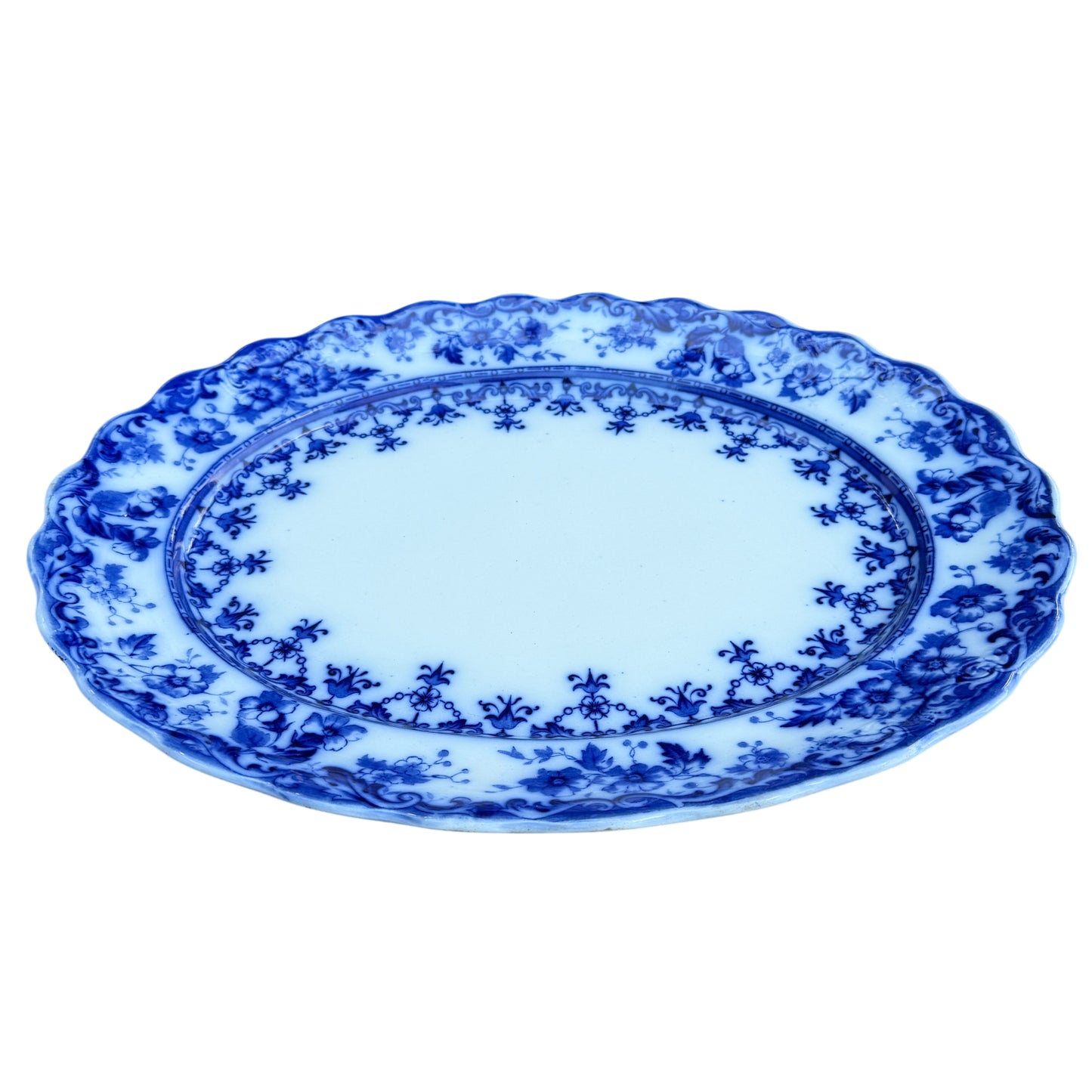 Blue and white Staffordshire transferware serving platter in Warwick pattern with scalloped rim