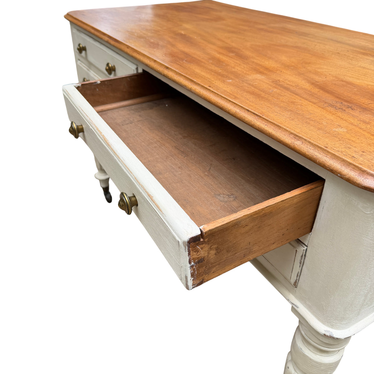 Painted dressing table with distressed off-white finish and brass drawer knobs
