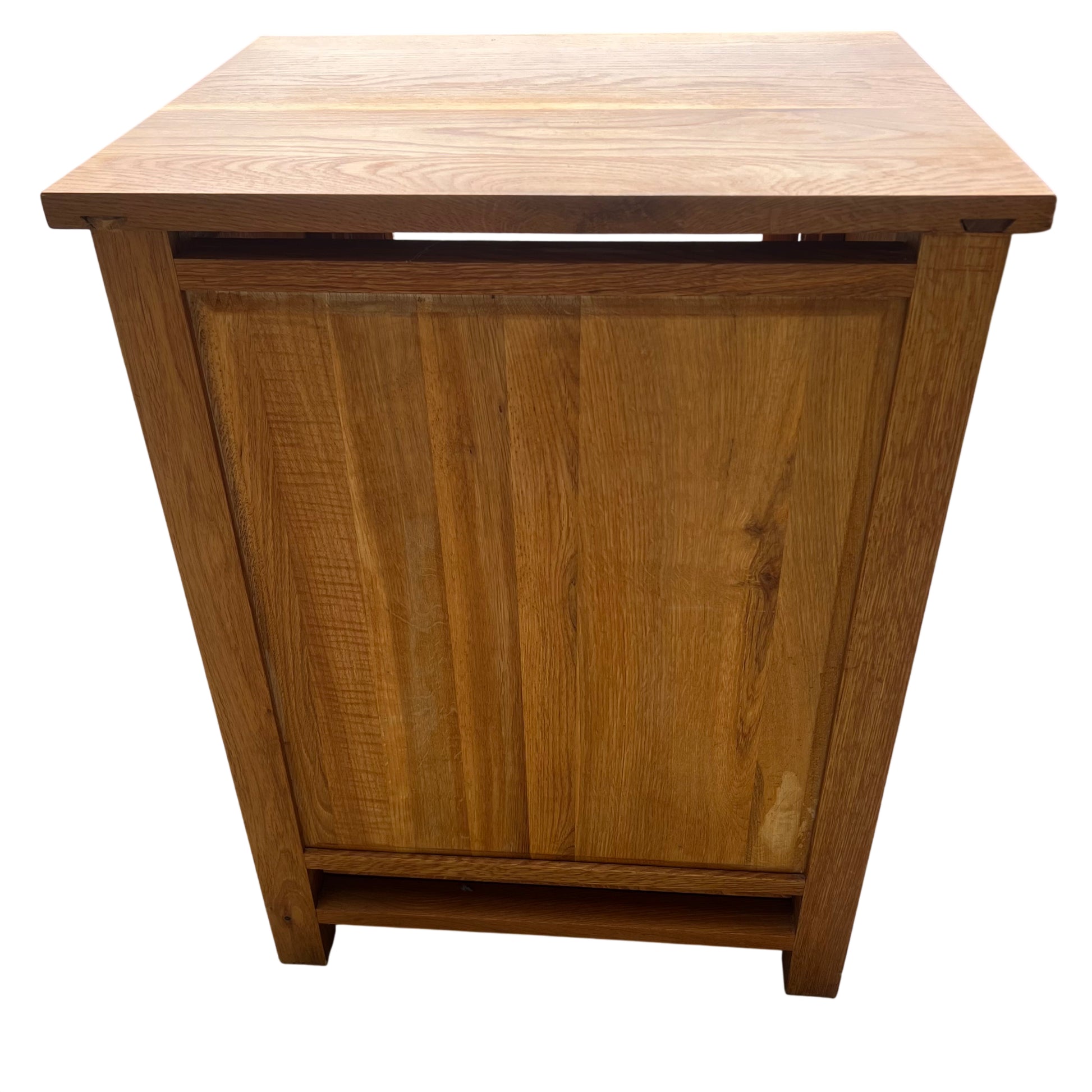 Side view of oak display cabinet showing paneled construction and legs