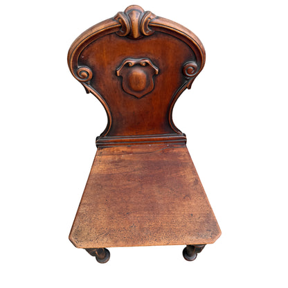 Turned front legs and swept rear legs of antique mahogany chair